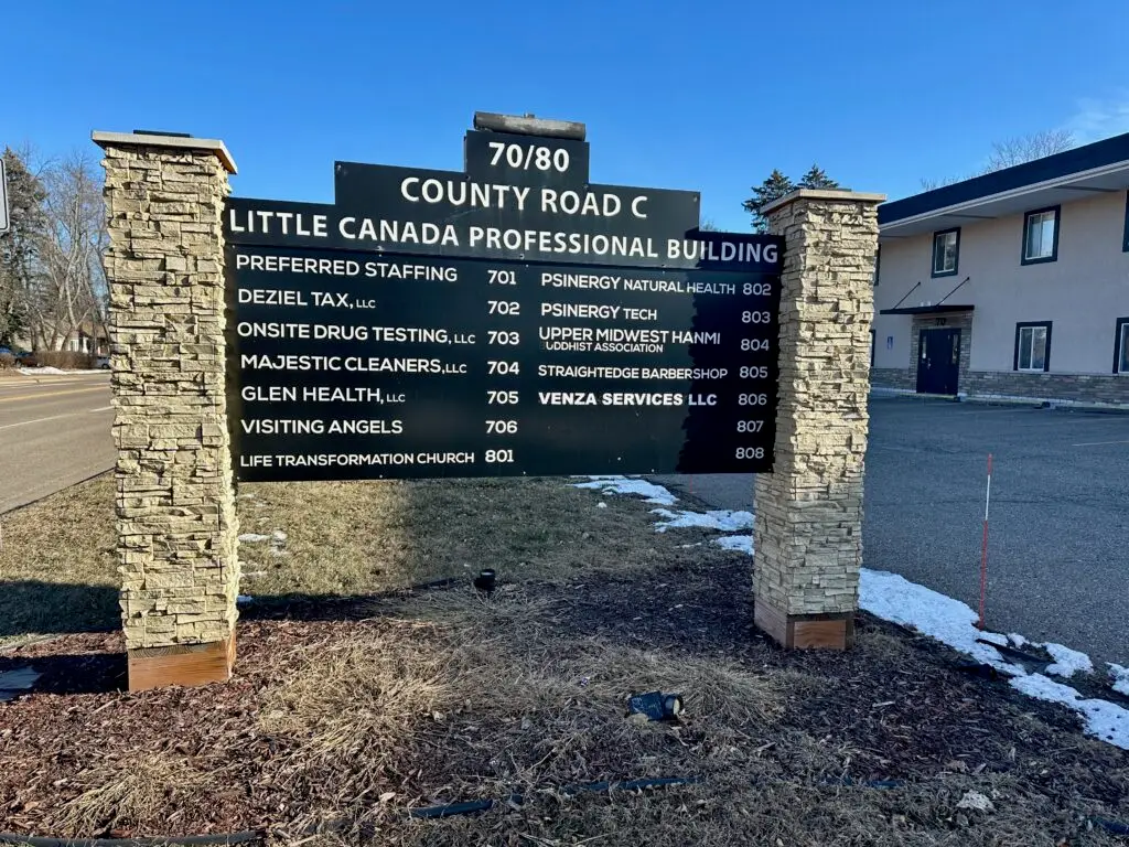 Building sign in front of our location